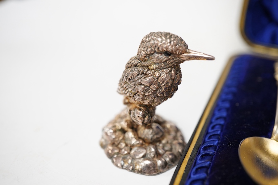 A modern silver shell dish on dolphin support, by Mappin & Webb, Sheffield, 1987, height 11cm, together with a cased set of six late Victorian parcel gilt silver apostle teaspoons, a 1960's small silver dish with Winston